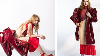 Two models, one sitting, one standing wearing a red and cream dress by designer Bex Cermin.