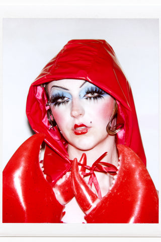 Close up of model wearing red pleather hood and lobster claws by Cardiovascuwhore