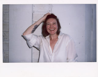 Polaroid of ShowHaus co-founder, Heather, laughing..