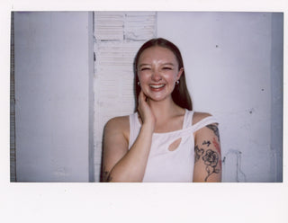 Polaroid of ShowHaus co-founder, Sami, laughing.