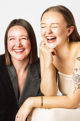 ShowHause founders, Sami and Heather, sitting close and laughing.